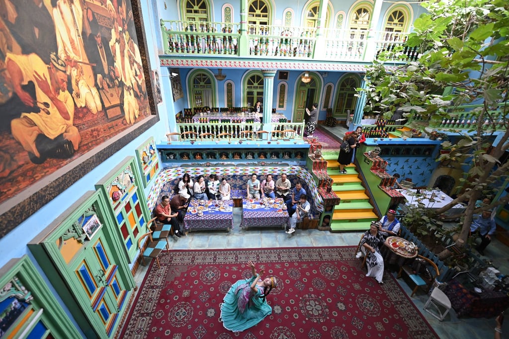 A performer dances at a homestay in the old town of Kashgar, a Silk Road city in northwest China’s Xinjiang. Photo: Xinhua