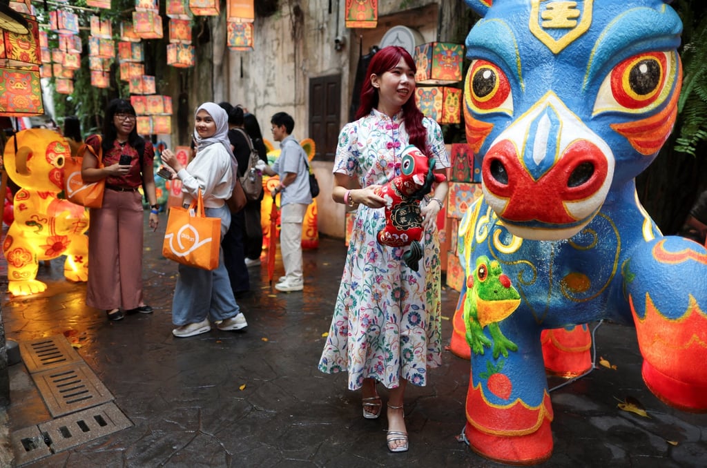 People visit a Chinese New Year art installation to welcome the Year of the Horse at Kwai Chai Hong in Chinatown, Kuala Lumpur, Malaysia, on January 29. Photo: Reuters