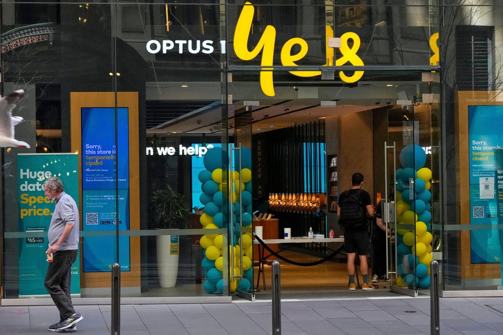 A customer waits for service at an Optus store in Sydney, Australia. Optus is a subsidiary of Singtel. Photo: AP