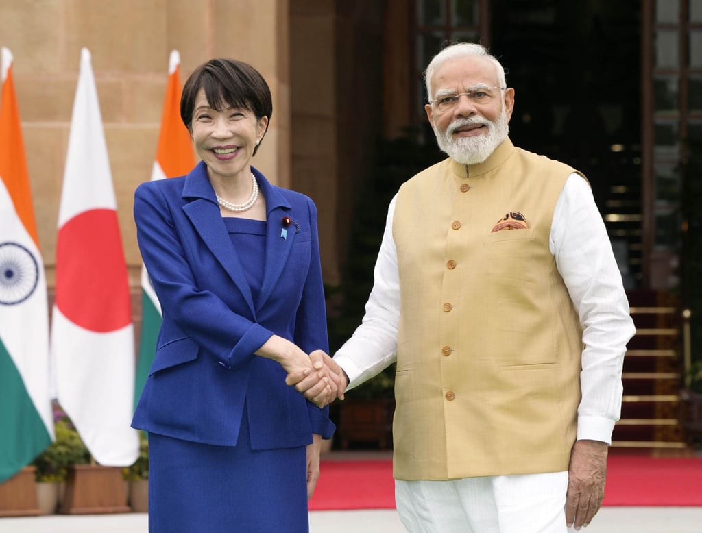 Japanese Prime Minister Sanae Takaichi (left) and her Indian counterpart Narendra Modi shake hands ahead of their talks in New Delhi on Thursday. Photo: Kyodo