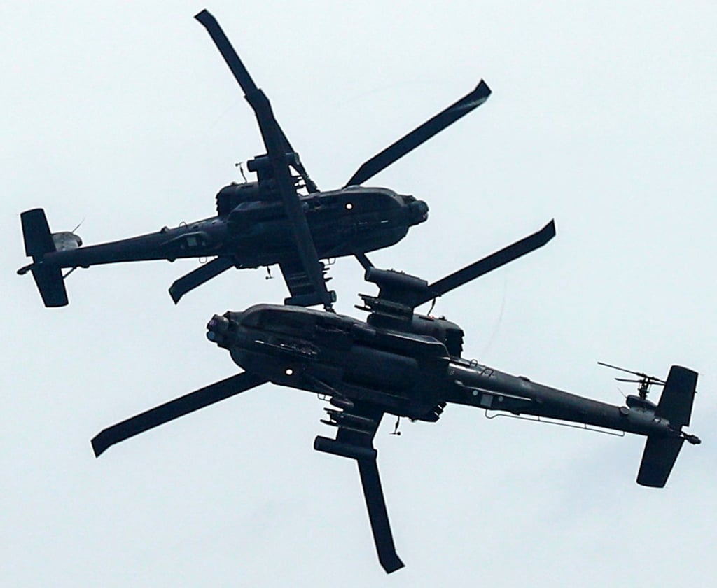 RSAF AH-64 Apache Longbow helicopters perform an aerial display at the Singapore Airshow in February 2020. Photo: Reuters