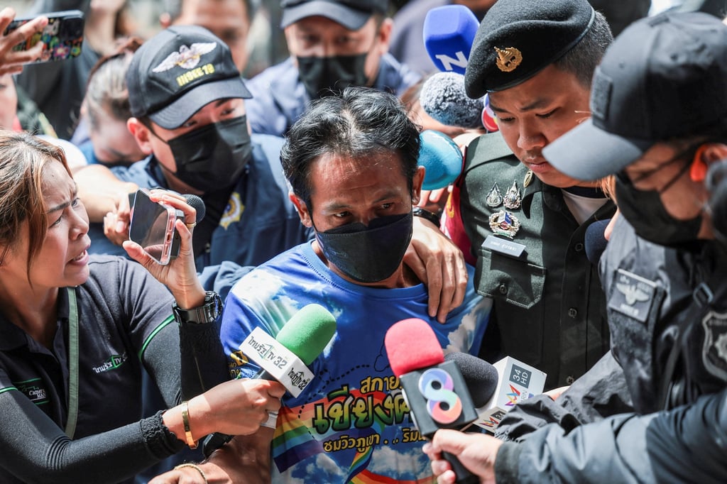 Two suspects, a Thai man and his Laotian wife, suspected of sending drug parcels from a border province to Bangkok, are escorted by officials to the Office of the Narcotics Control Board (ONCB) in Bangkok on Friday. Photo: Reuters