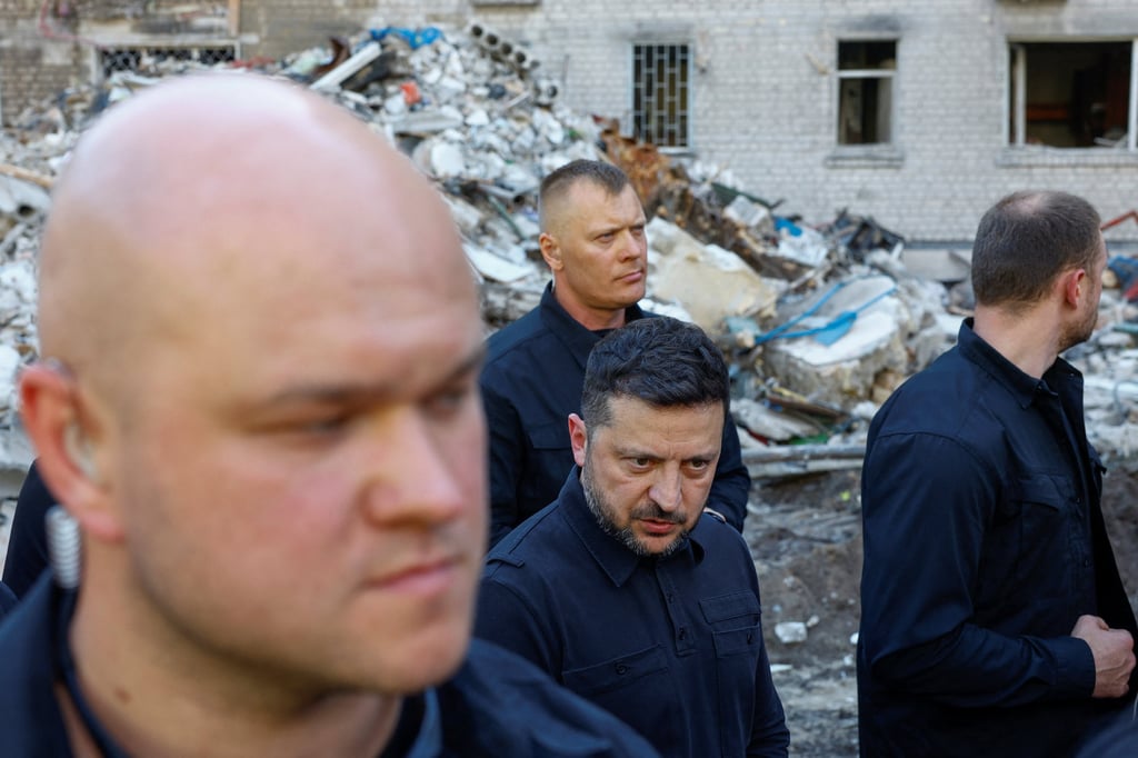 Ukraine’s President Volodymyr Zelensky speaks to the media as he visits the site of an apartment building damaged by Russian air strikes in Kyiv on Thursday. Photo: Reuters