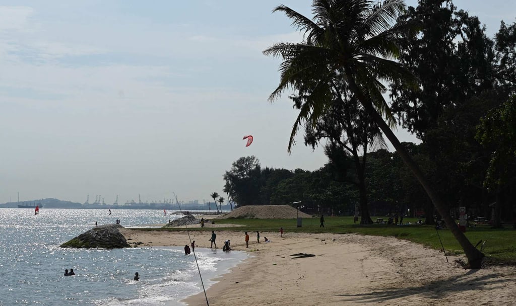 People relax on a beach at East Coast Park in Singapore in December 2020. Photo: AFP