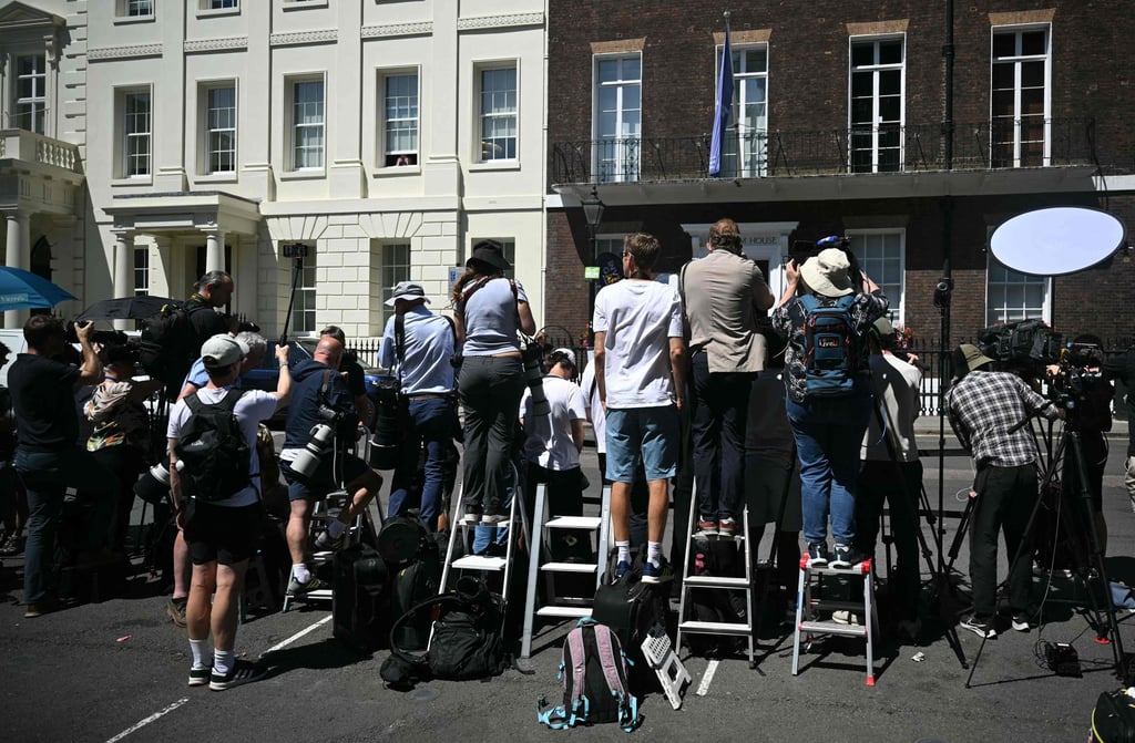 Media gather for the arrival of Britain’s Prince Harry at Chatham House in central London on Tuesday. Photo: AFP