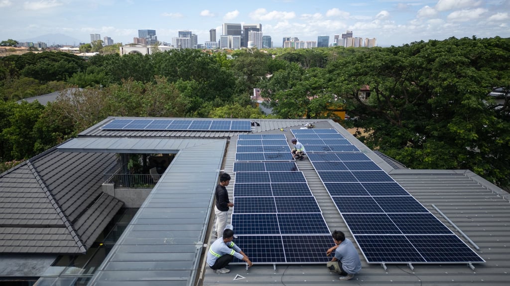 A team of installers set up a new rooftop solar system at a home in Manila on May 1. Between March and May, the Philippines imported US$407 million worth of solar panels from China. Photo: AP
