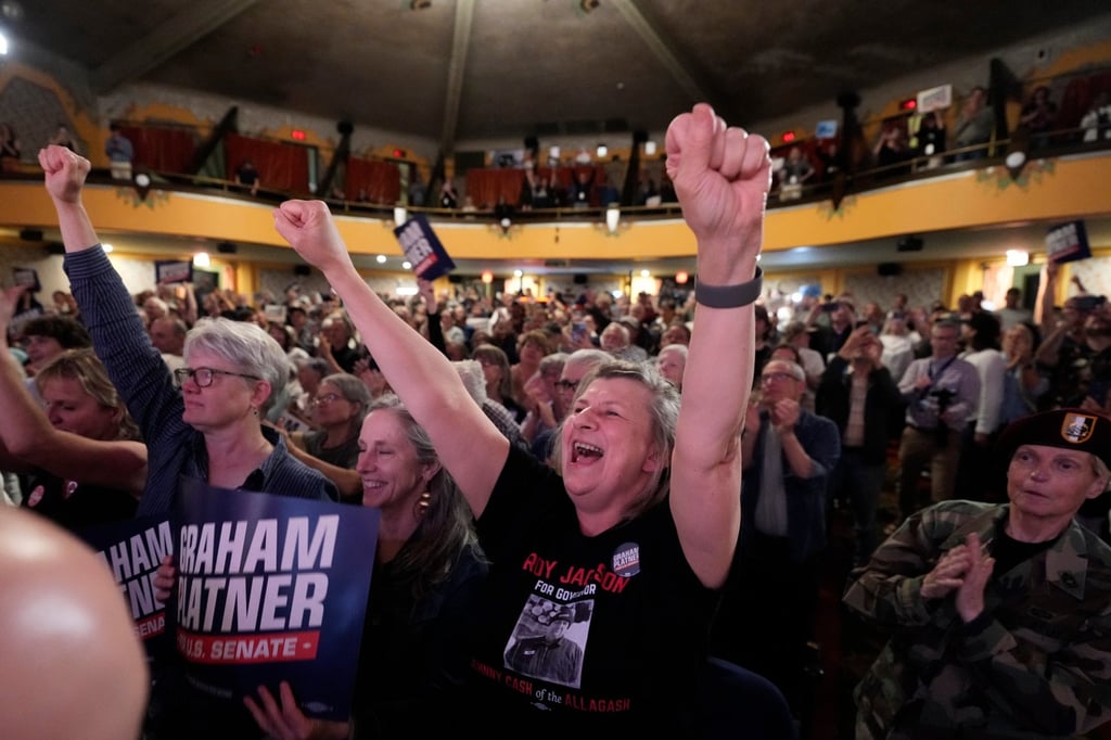 Supporters cheer for Graham Platner at a campaign event. Photo: AP