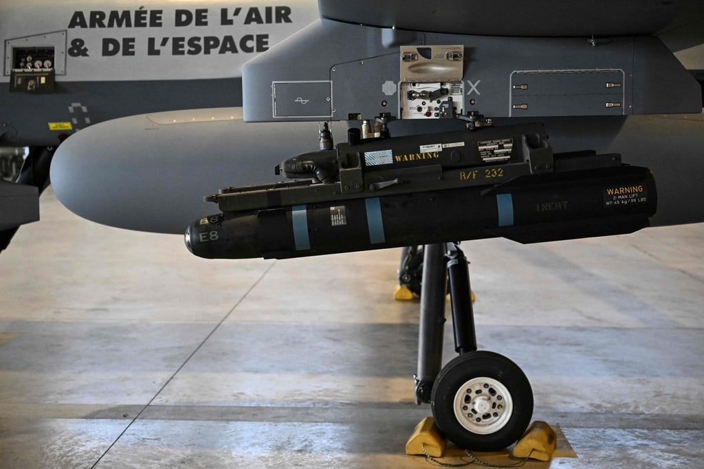 A model of a Hellfire missile attached under the wing of an MQ-9 Reaper military drone during a demonstration in Chateaubernard, France. Photo: AFP