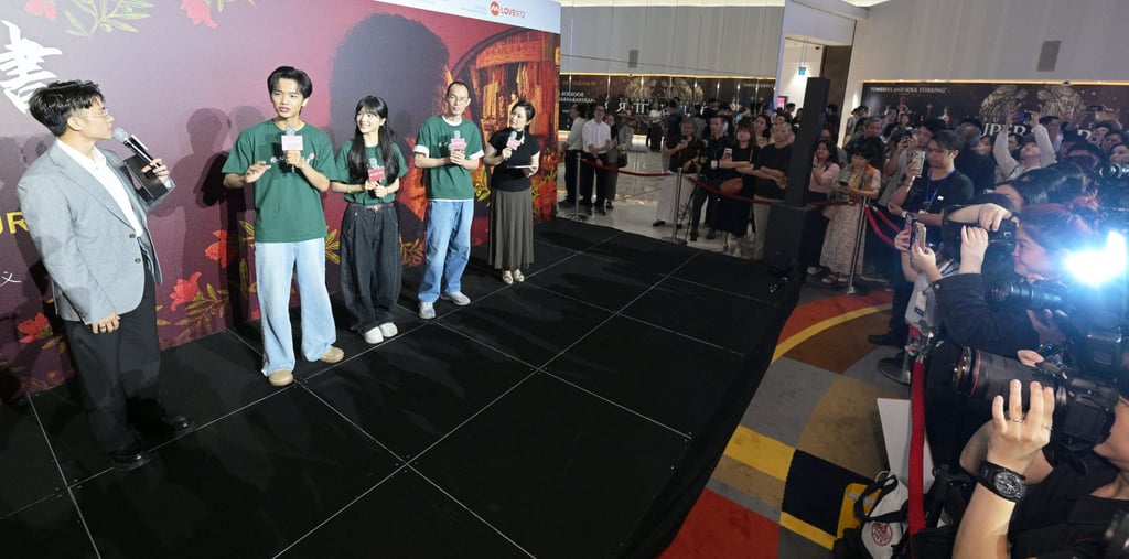 Chinese director Lan Hongchun (fourth from left) and the cast of “Dear You” speak at the film’s premiere in Singapore on June 17. Photo: Xinhua