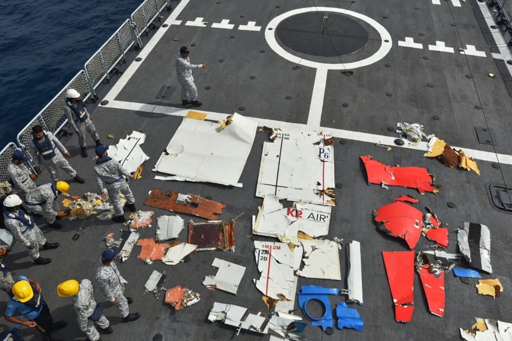 Pakistan Navy personnel examine the wreckage of a cargo plane of the private carrier K2 Airways on a naval ship after recovering them from deep sea west of Karachi on Wednesday. Photo: Pakistan Navy via AP