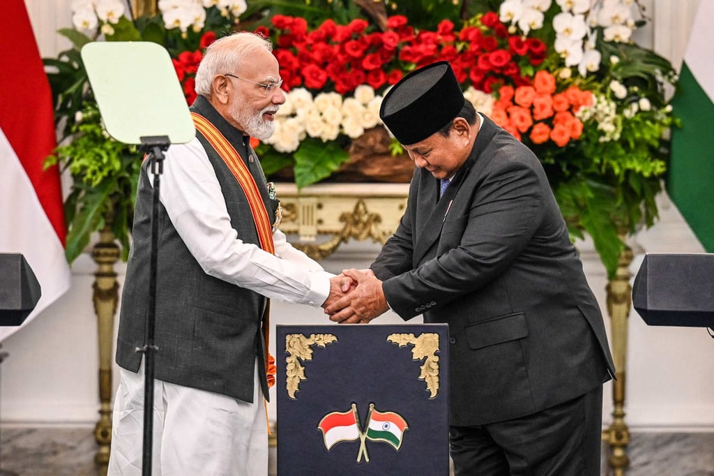 India’s Prime Minister Narendra Modi and Indonesia’s President Prabowo Subianto shake hands after attending a joint press conference at the Merdeka Palace in Jakarta on Tuesday. Photo: AFP