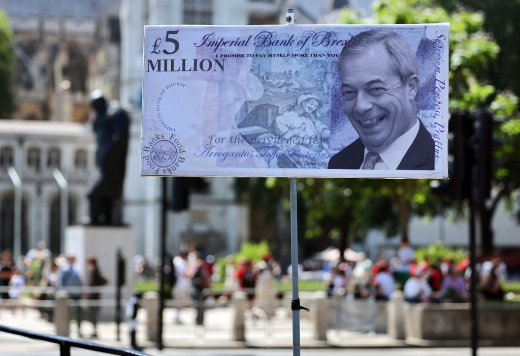 A£5 million note bearing the face of Reform UK leader Nigel Farage is displayed during a protest outside parliament in London on Wednesday. Photo: EPA