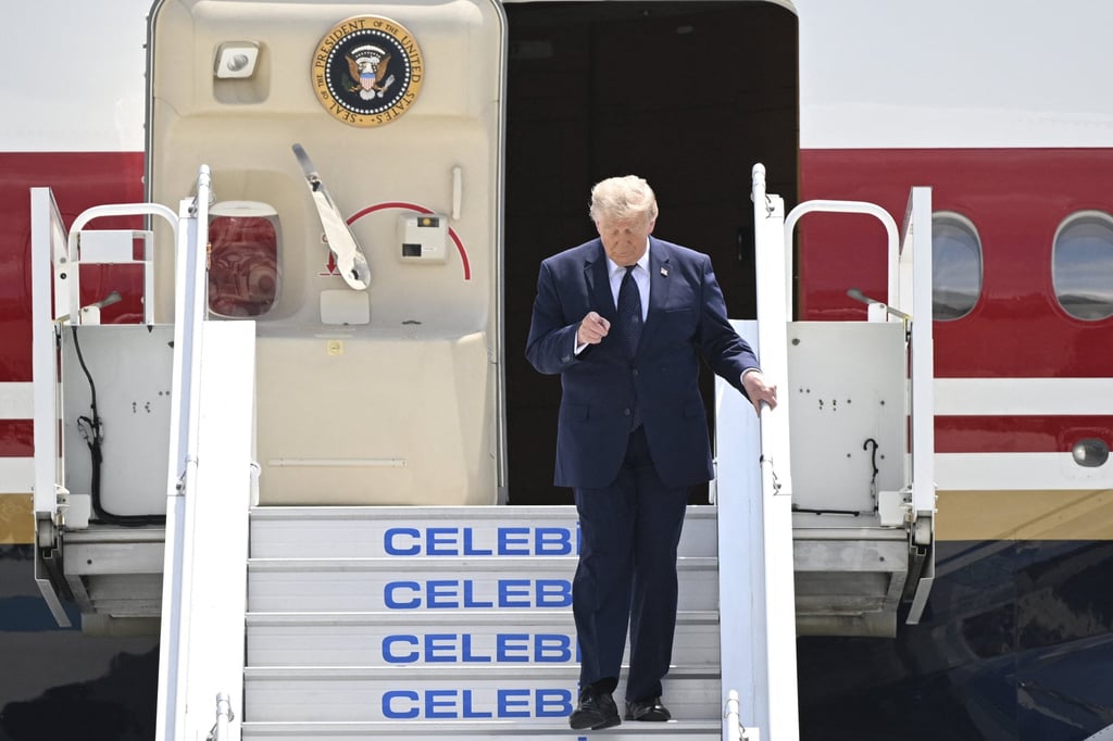 US President Donald Trump disembarks from Air Force One upon his arrival at Etimesgut Air Base near Ankara, Turkey, on Tuesday. Photo: AFP
