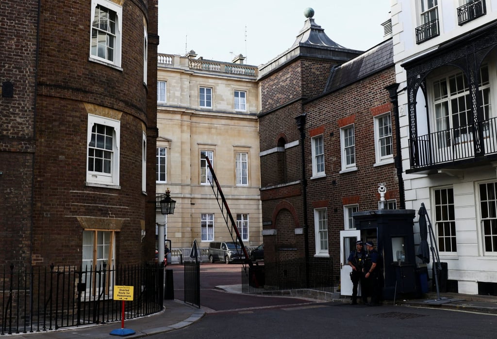 Police officers stand guard outside a rear entrance to Clarence House, an official residence of Britain’s King Charles, in London on Tuesday. Photo: Reuters