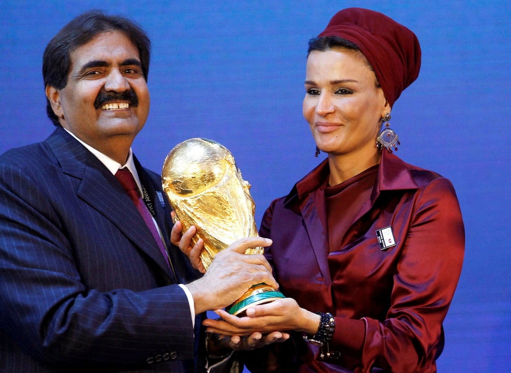 Sheikh Hamad bin Khalifa Al Thani and his wife hold a copy of the Fifa World Cup trophy in Zurich in December 2010. Photo: Reuters