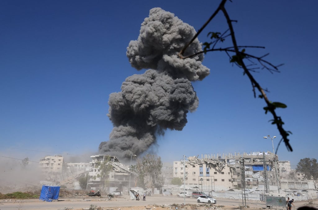 Smoke rises following an Israeli strike on a metal foundry in Gaza City on Sunday. Photo: Reuters