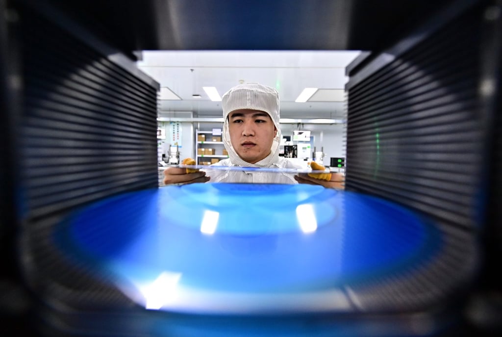 An employee packages semiconductor power devices for export in Fuzhou, in China’s central Jiangxi province. Photo: Getty Images