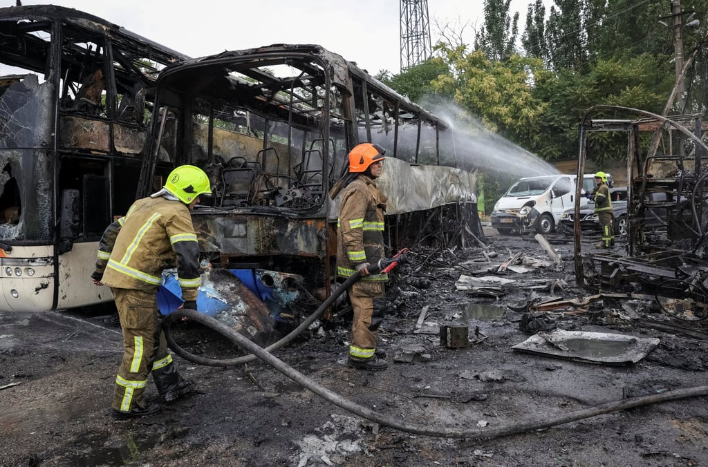 Firefighters work at the site of a bus parking area hit by a Russian drone strike in Odesa, Ukraine on Monday. Photo: Reuters