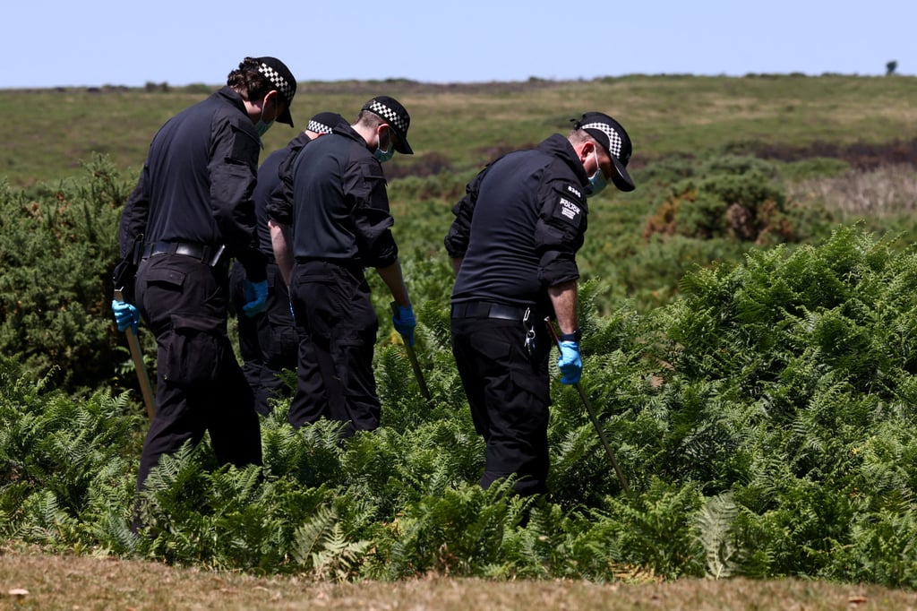 Police officers investigate the area near the home of 78-year-old former government minister Ann Widdecombe after she was found dead, in Haytor, Britain, on Saturday. Photo: Reuters