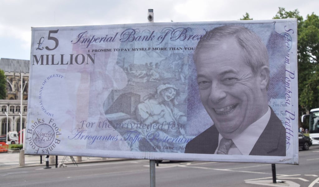 A mock £5 million note with a portrait of Nigel Farage is displayed during the weekly anti-Brexit protest in Parliament Square on Wednesday. Photo: dpa