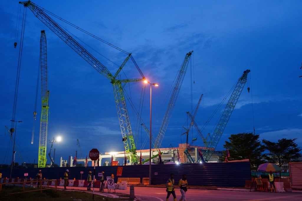 Workers walk past a data centre under construction in Malaysia’s Johor state in 2024. Photo: AP