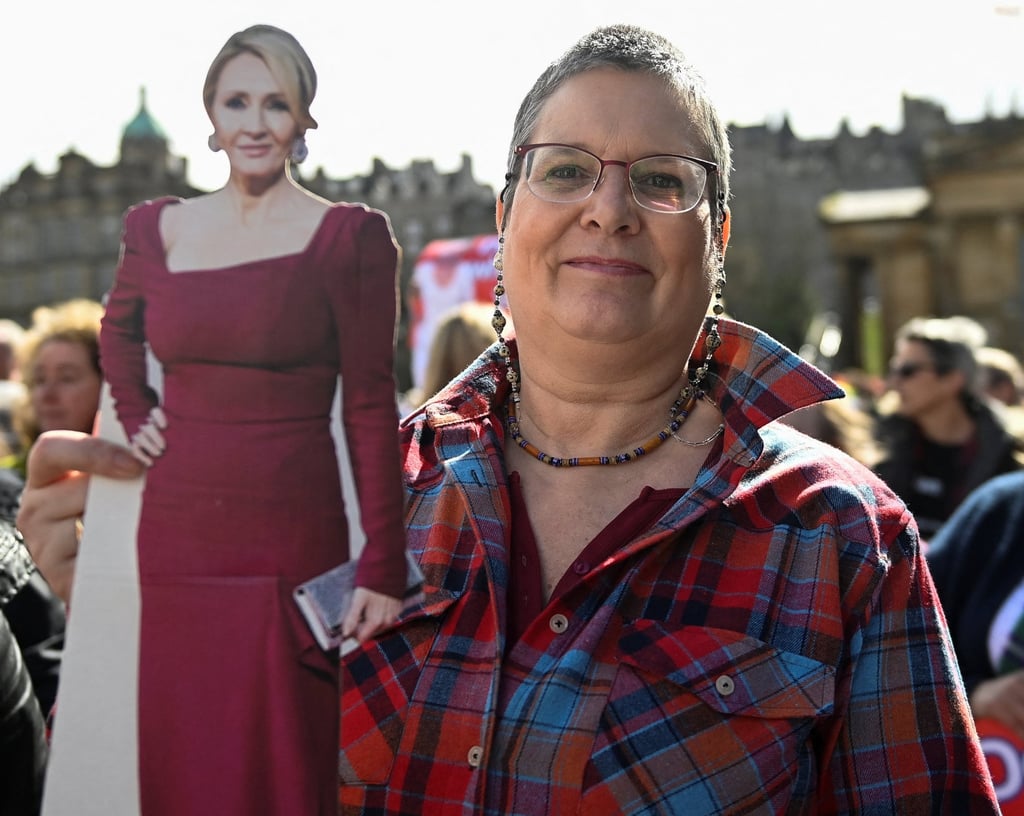 An anti-transgender rights activist holds a cut-out of writer J.K. Rowling, during a rally outside the Royal Scottish Academy in Edinburgh on April 6, 2024. Photo: Reuters