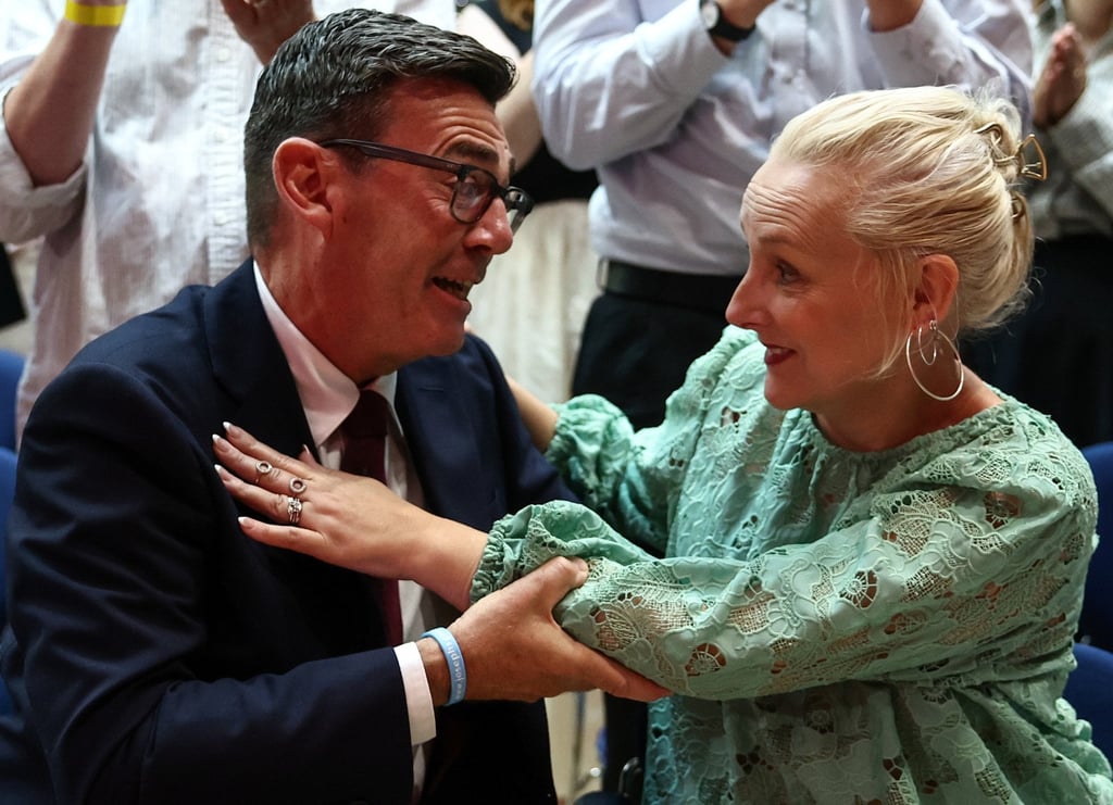 Andy Burnham hugs his wife, Marie-France van Heel, after being confirmed as the Labour Party’s new leader on Friday. Photo: EPA