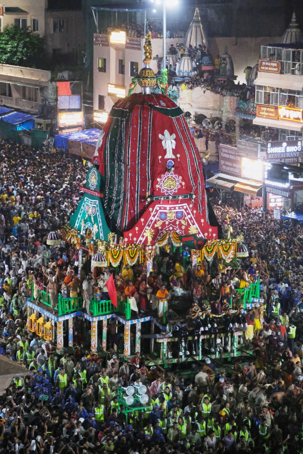 Hindu devotees surround the chariot of Lord Jagannath during the annual chariot procession, in Puri, India, on Thursday. Photo: AP
