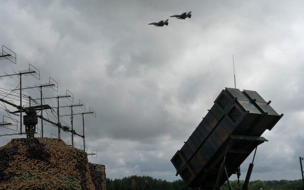 Ukrainian Air Force’s F-16 fighter jets fly over a Patriot air and missile defence system on August 4, 2024. Photo: AP