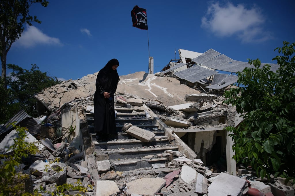 Fatima Mokdad stands amid the rubble of her home on Tuesday, after it was destroyed in an Israeli air strike in Froun village, southern Lebanon. Photo: AP