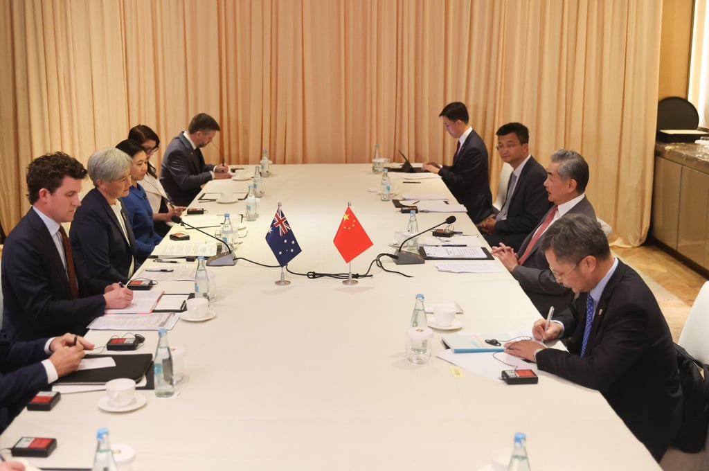 The Australian side, led by Foreign Minister Penny Wong (centre left), and Chinese Foreign Minister Wang Yi (centre right) with his team, meet on the sidelines of an Asean forum in Manila on Tuesday. Photo: Xinhua