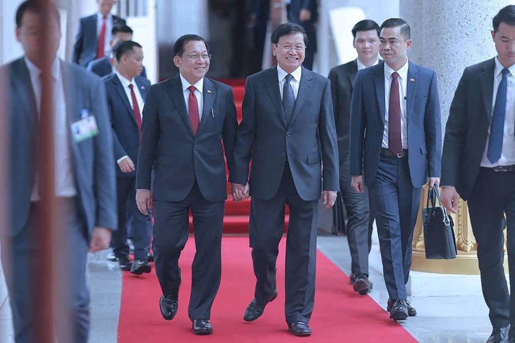 Myanmar’s President Min Aung Hlaing (left) walks with Lao President Thongloun Sisoulith after a memorandum of understanding signing in Vientiane on July 3. Photo: Myanmar’s Presidential Press and Information Bureau/AFP