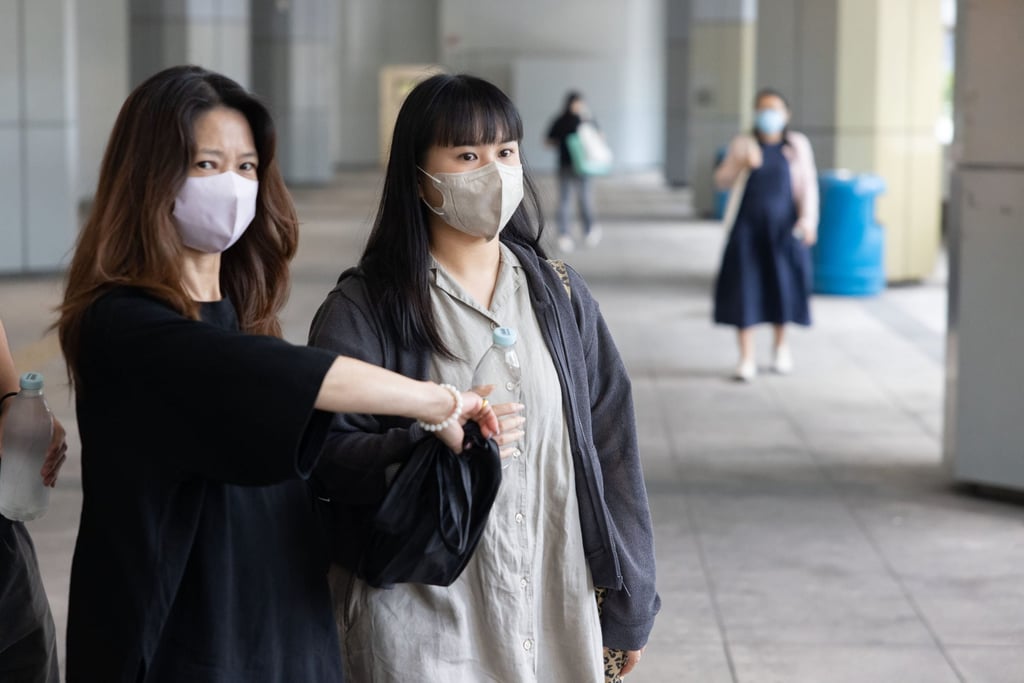 Park Hoi-lam (right) leaves the High Court on Tuesday. She has accused cabby Henry Cheng of negligence. Photo: Brian Wong
