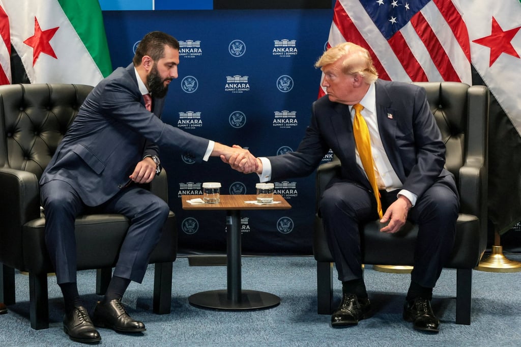US President Donald Trump (right) shakes hands with Syrian President Ahmed al-Sharaa on the sidelines of the Nato summit in Ankara, Turkey, on July 8. Photo: Reuters