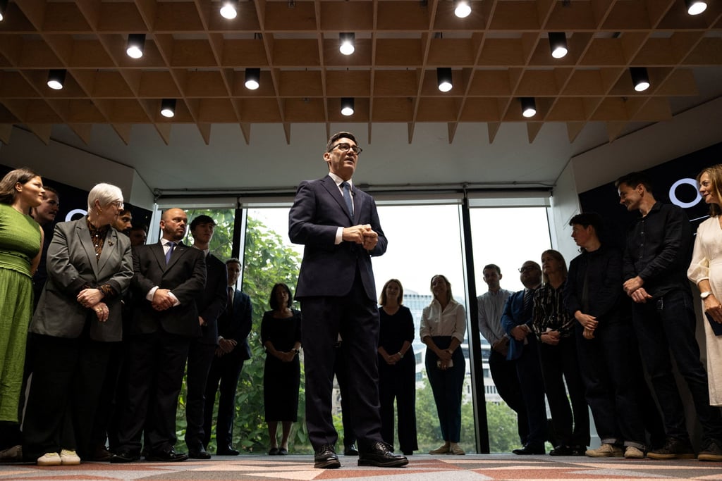 Britain’s Prime Minister Andy Burnham welcomes staff to Number 10 North in Manchester on Friday. Photo: via Reuters