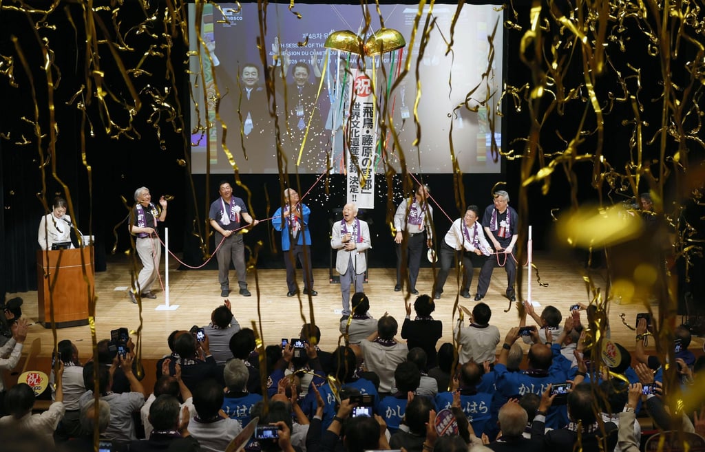 People celebrate in Kashihara, Nara prefecture, on Sunday after Unesco decides to add the ancient Japanese capitals of Asuka and Fujiwara to the World Heritage List. Photo: Kyodo/AP
