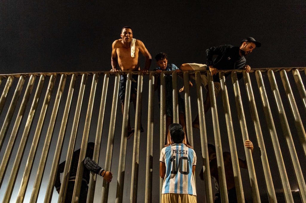 Migrants try to cross from Morocco into the Spanish enclave of Ceuta on Friday. Photo: AP