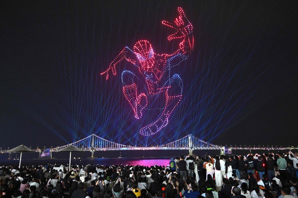 A swarm of 1,500 drones forms the shape of Spider-Man above Gwangan Bridge during a light show at Gwangalli Beach in Busan on May 2. Photo: AFP