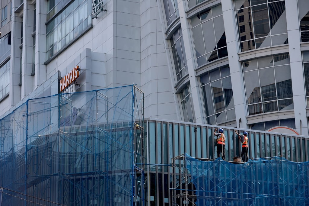 Labourers work at a construction site in Jakarta in July. Indonesia’s so-called Nine Dragons have interests spanning banking, tobacco, property, palm oil, mining and consumer goods. Photo: EPA