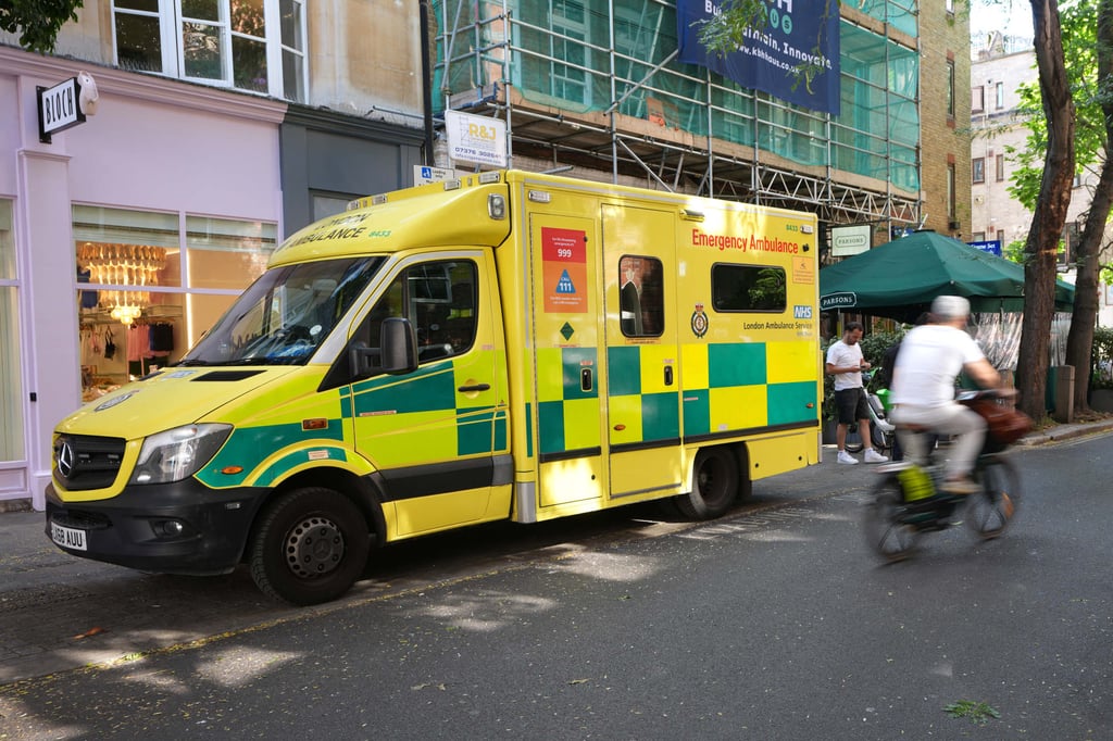 An ambulance stands at the scene on Endell Street in Covent Garden after four men were stabbed in central London on Wednesday. Photo: AP