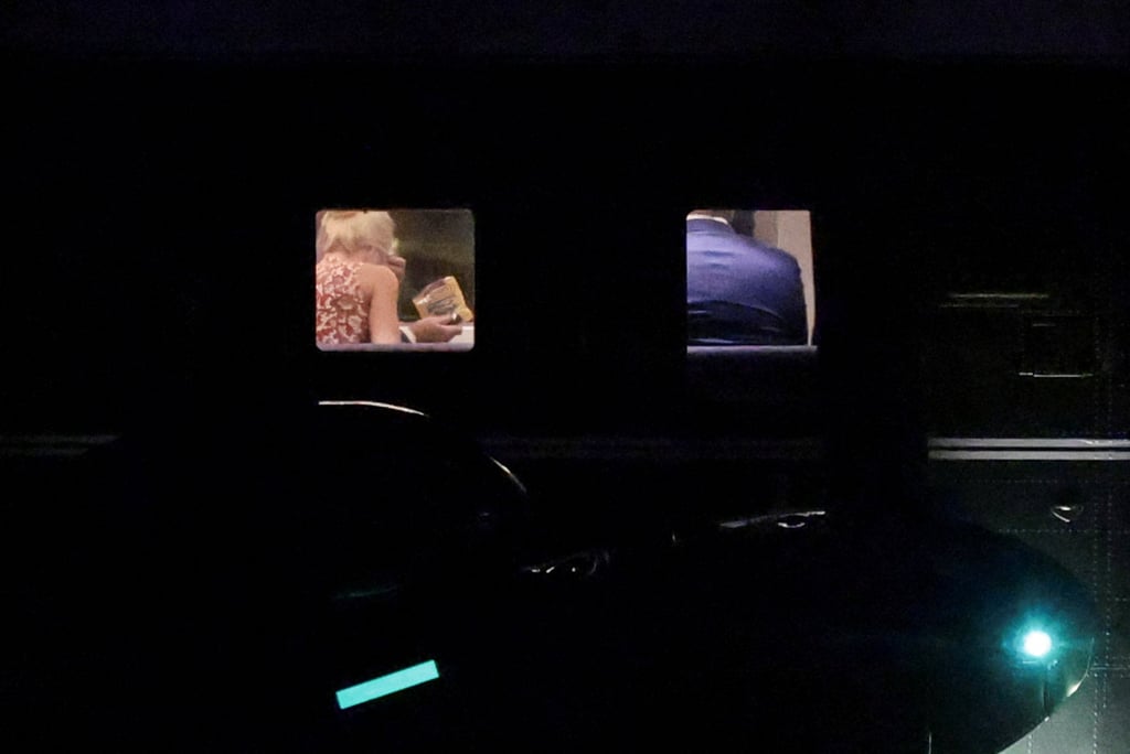 US President Donald Trump holds a packet of pretzels while aboard Marine One at Trump National Golf Club Los Angeles Rancho Palos Verdes on Tuesday. Photo: Reuters