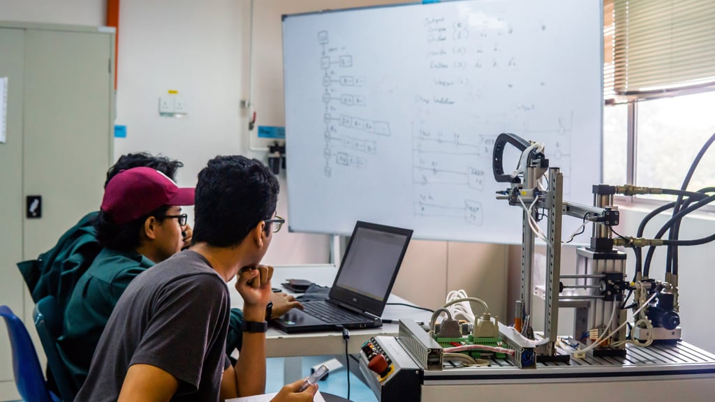 Students discuss an automation machine system in a laboratory in Bangi, Malaysia. The Malaysian government is seeking to advance the country’s semiconductor sector under its 2030 masterplan. Photo: TNS