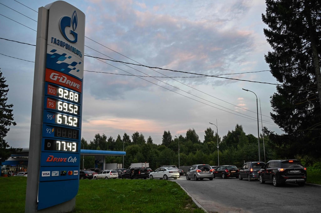 People queue to refuel their cars at a petrol station on the outskirts of Pereslavl-Zalesskiy, about 140km from Moscow, on Thursday. Several regions have introduced rationing. Photo: AFP
