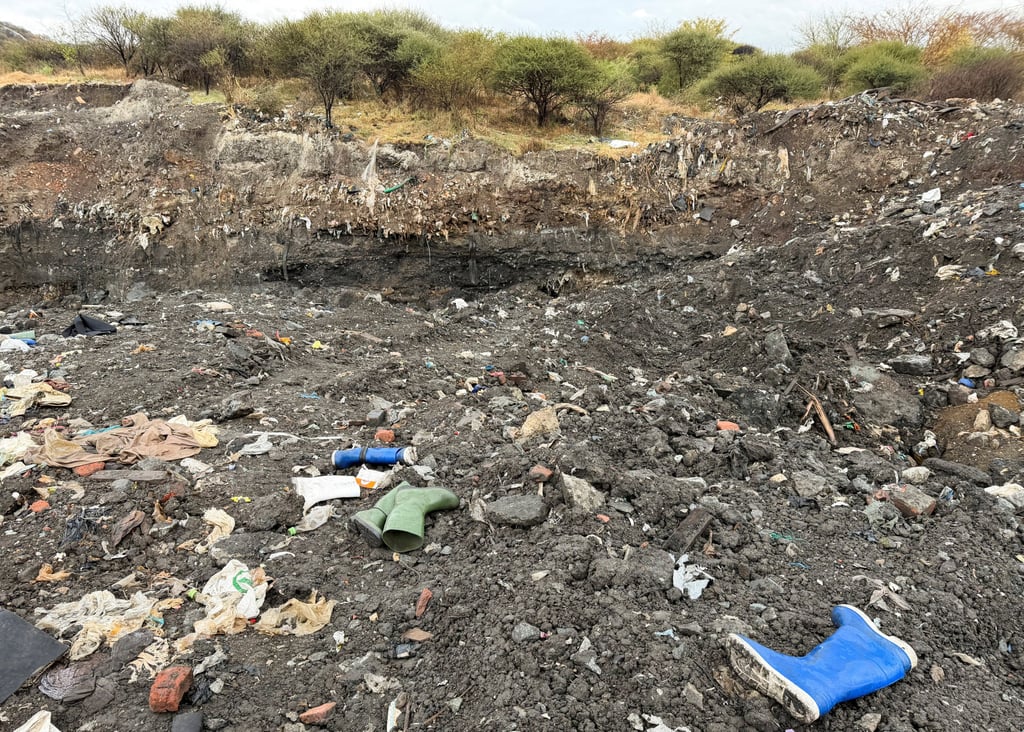 Rubber boots believed to belong to illegal miners lay near a shaft entrance at a disused mine near Rustenburg, North West province, South Africa. Photo: Reuters