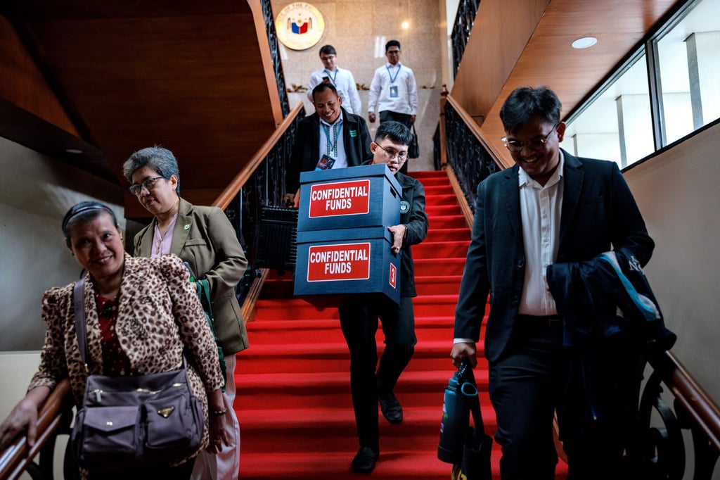 A worker carries boxes labelled “Confidential Funds” containing documents presented during the impeachment trial of Philippine Vice-President Sara Duterte-Carpio in Metro Manila, Philippines, on August 3. Photo: AP