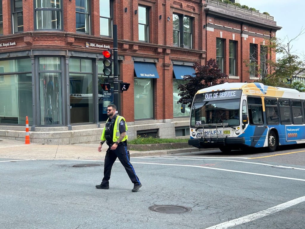 A police officer near the US consulate in Halifax, Nova Scotia, Canada on Monday following a bomb threat. Photo: The Canadian Press via AP