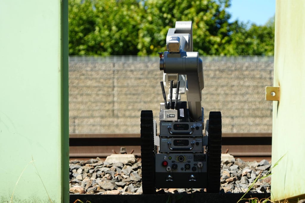 A bomb-disposal robot is deployed at a railway station in Middle Franconia, where special forces from the Federal Police examine an object suspected of containing explosives. Photo: dpa