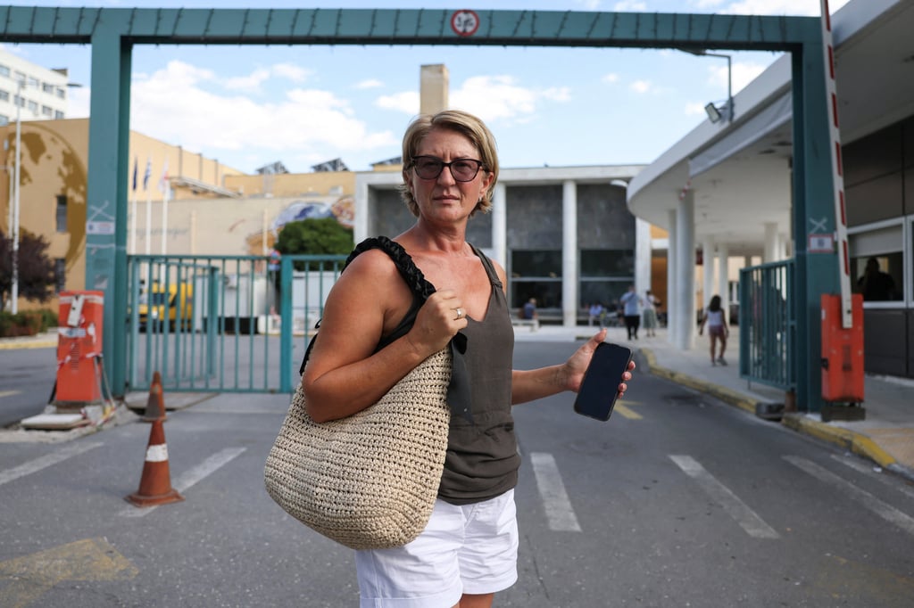 Svetlana Grkovic Maksimovic, the wife of the Ryanair passenger partially sucked out of a broken window, stands in front of the hospital where her husband was taken in Thessaloniki, Greece, in July. Photo: Reuters