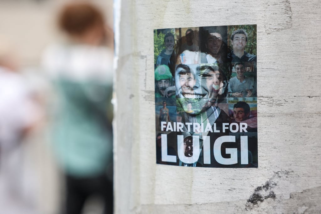 A sticker with images of Luigi Mangione is seen on a pole outside Manhattan Criminal Court in New York City on Friday. Resolving the federal case could allow Mangione to seek dismissal of the murder charge under New York’s double jeopardy law. Photo: Reuters