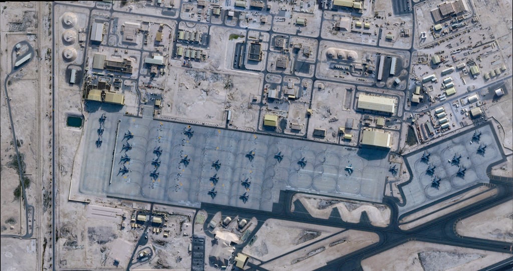 A satellite image shows aircraft at the Al Udeid Air Base, near Doha, Qatar, in February. Image: Planet Labs PBC via Reuters